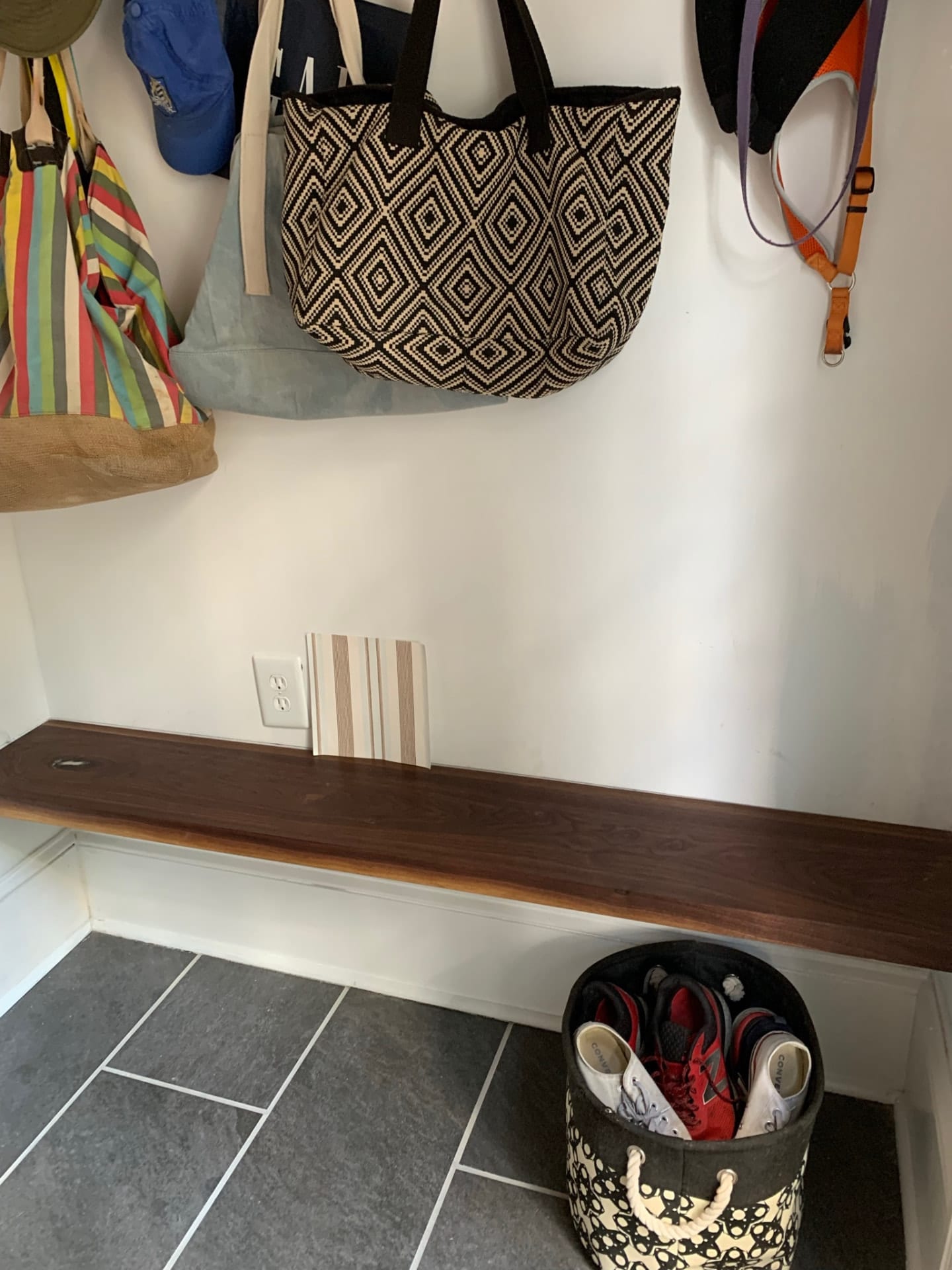 Floating walnut mudroom bench