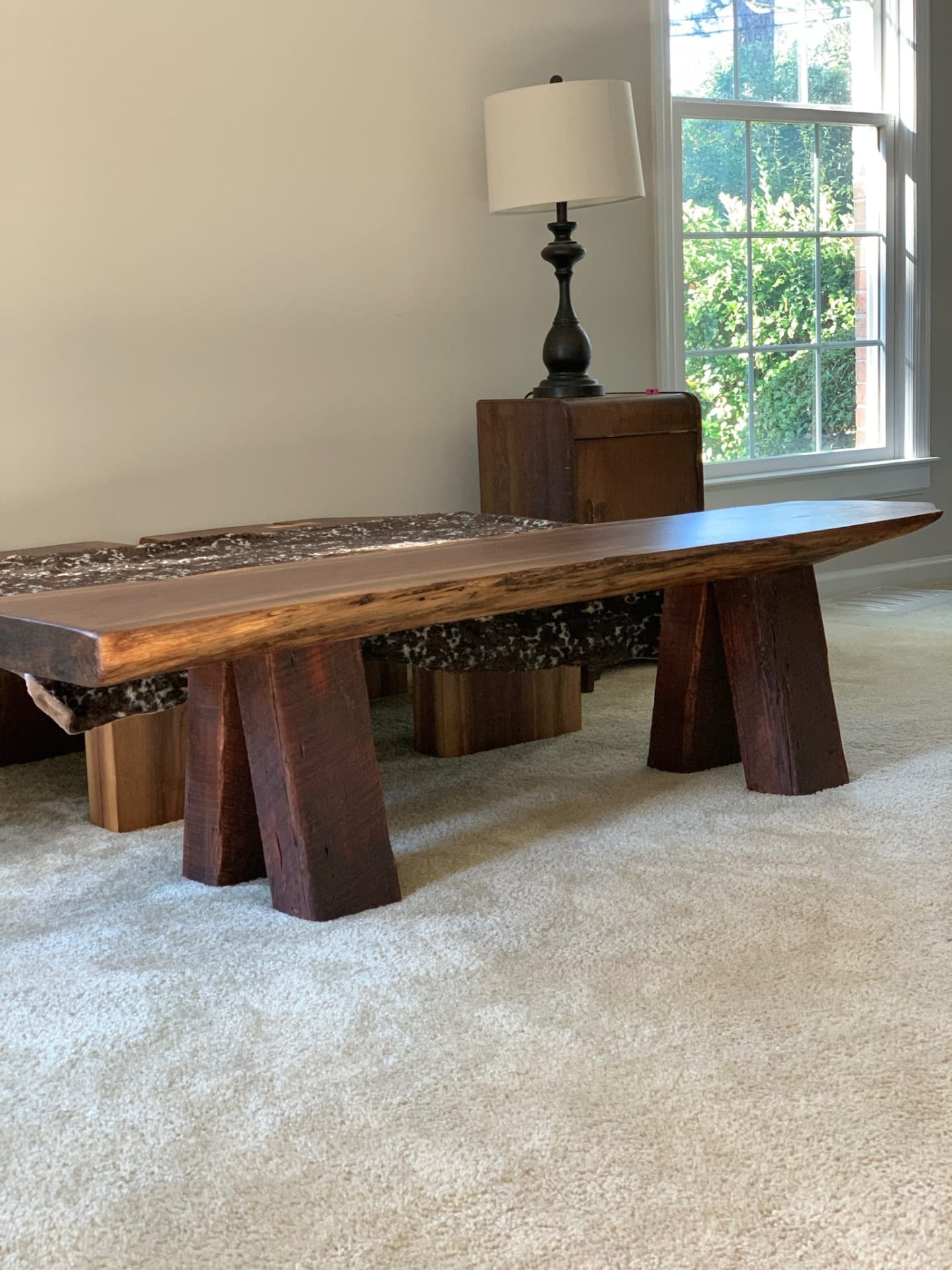 Walnut slab bench on reclaimed beams
