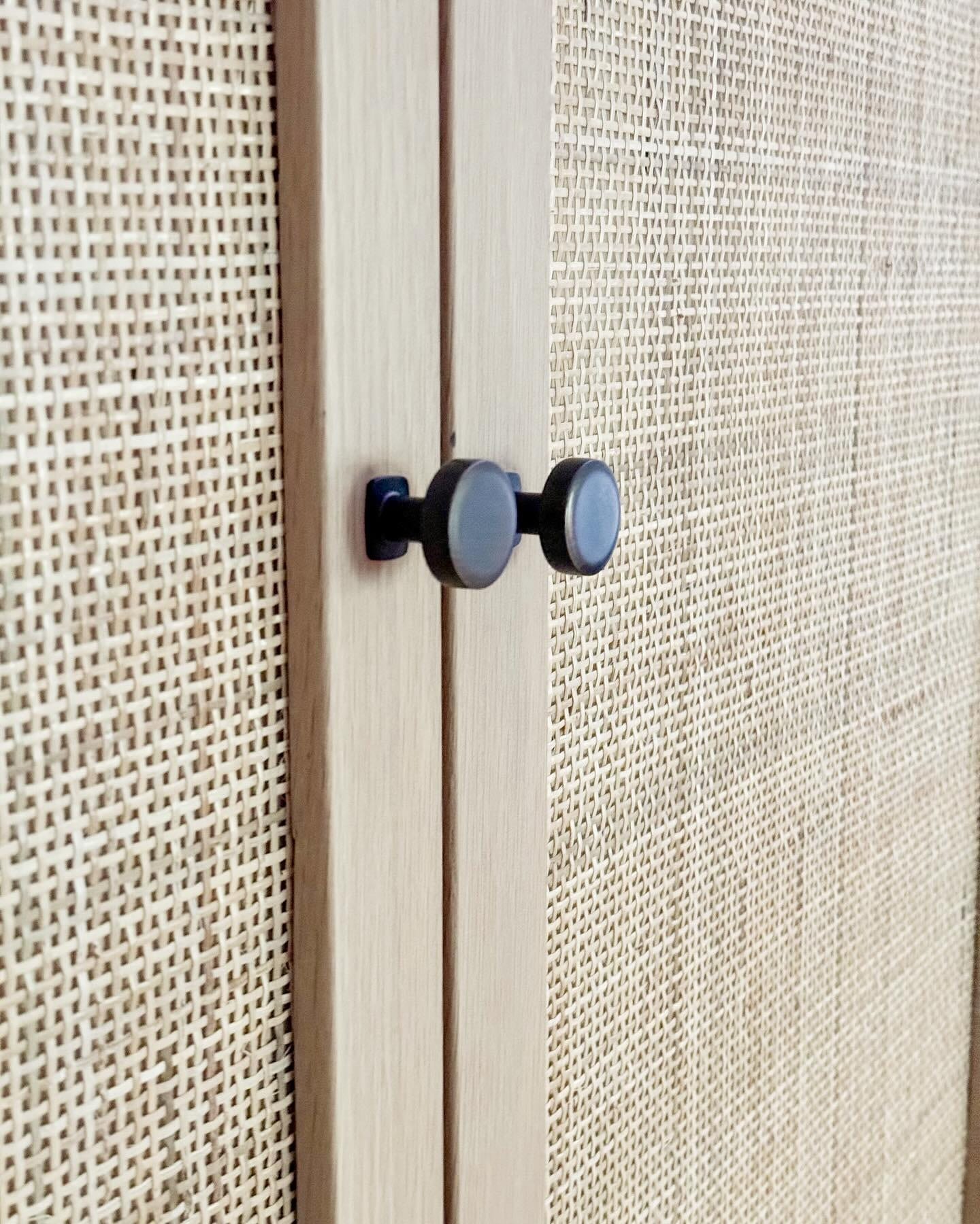 Handcrafted oak cabinet with woven cane detail
